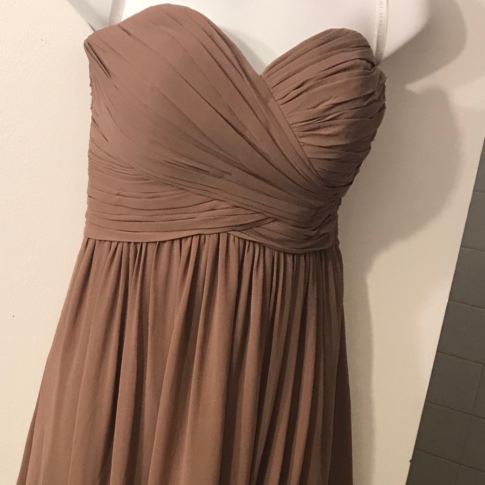 It’s a really long strapless dress skin color